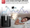 An ice maker is shown in the foreground, with a woman sleeping in a bed in the background. A graph illustrating noise levels is displayed above the ice maker. Náhled obrázku produktu