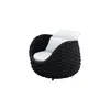 A single black armchair with white cushions, isolated on a white background. Produktbild-Vorschau