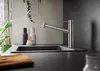 A modern kitchen sink area with a faucet, sink, and countertop. Produktbild-Vorschau