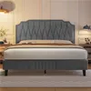 A bed in a bedroom setting with bedside tables and lamps. Produktbild-Vorschau