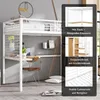 A white metal loft bed with a desk and stairs, set up in a room. Produktbild-Vorschau