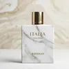 A perfume bottle with a marble-like design and a gold cap, set against a marbled background. Náhled obrázku produktu