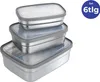 A stack of three stainless steel lunchboxes with gray lids against a white background. Produktbild-Vorschau