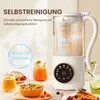 A multifunctional soy milk maker is shown on a table with various food and drink items, highlighting its self-cleaning feature. Voir les images du produit