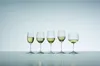 Five wine glasses filled with white wine are lined up on a reflective surface against a light blue-grey background. Náhľad obrázku produktu