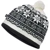 A close-up studio shot of a knitted beanie with a snowflake pattern. Náhled obrázku produktu