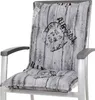 A close-up view of a chair cushion with a wood-grain pattern and stamp-like graphics. Produktbild-Vorschau