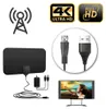Schwarze Flachbild-HDTV-Antenne mit Kabeln und Netzteil, neben einem Fernseher, der eine Frau am Strand zeigt, mit 4K ULTRAHD- und FULL HD-Abzeichen Productafbeelding-voorbeeld