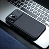 A black phone case with a textured pattern is placed on a laptop keyboard. Náhľad obrázku produktu