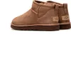 A pair of brown UGG boots are shown against a white background. Produktbild-Vorschau