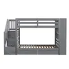 A gray bunk bed with stairs and drawers, shown from the side against a white background. Voir les images du produit