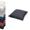 A stack of pillowcases in various colors and a single dark gray pillowcase in the foreground. Produktbild-Vorschau