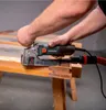 A person is using a Metabo lackfräse (paint planer) on a wooden surface. Anteprima dell’immagine prodotto