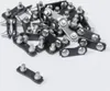 A pile of metal chain links with rivets on a white background. Produktbild-Vorschau