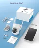 Product packaging and components for a security camera system are laid out on a blue surface. Produktbild-Vorschau