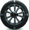 A snow chain is mounted on a car wheel. Produktbild-Vorschau