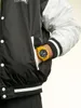 A person wearing a jacket and a yellow watch. Náhled obrázku produktu