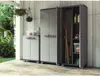 Outdoor storage cabinets are shown on a patio next to a wall with hanging plants. Voir les images du produit