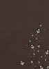 A close-up view of a brown textured fabric with water droplets on it. Anteprima dell’immagine prodotto
