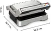 A silver and black Tefal OptiGrill 4in1 contact grill is shown from a slightly elevated front-left angle on a white background. Dimensions are indicated with lines and text. Produktbild-Vorschau