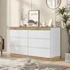 A modern dresser with white drawers and a wood-tone top and base, placed in a well-lit room with decor. Voir les images du produit