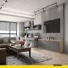 A modern living room/office space with a sofa, coffee table, desk area with computers, and a sideboard. Anteprima dell’immagine prodotto