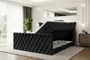 A black velvet upholstered bed with its storage compartment open, set in a well-lit bedroom. Produktbild-Vorschau