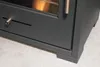 A close-up view of the bottom section of a dark gray bioethanol fireplace, focusing on the base and a drawer. Náhled obrázku produktu