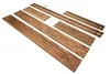 Wooden components for a grave frame are laid out on a white background. Anteprima dell’immagine prodotto