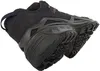 A close-up, angled view of the sole and heel of a dark brown and black hiking shoe. Anteprima dell’immagine prodotto