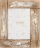 A rustic wooden picture frame with a floral patterned insert. Produktbild-Vorschau