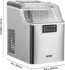 A stainless steel ice maker with a clear lid and control panel, shown with dimensions indicated by lines and text. Podgląd zdjęcia produktu