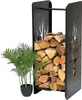 A black metal firewood rack filled with logs, next to a potted green plant. Voir les images du produit