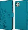 A teal flip phone case with a floral design is shown open and closed. Náhled obrázku produktu