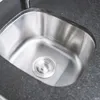 A close-up view of a stainless steel sink with a black countertop. Náhľad obrázku produktu