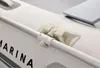 Close-up of an oar lock mechanism on the side of an inflatable boat. Voir les images du produit