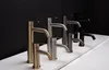 A line of modern faucets in different finishes displayed on a white surface against a black background. Anteprima dell’immagine prodotto