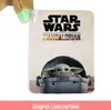A product tag for a Star Wars The Mandalorian plush toy, featuring Baby Yoda in its pram. Produktbild-Vorschau