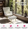 A modern armchair and ottoman set are placed in a bright room with a large window overlooking greenery. The scene is designed to evoke a sense of relaxation and style. Náhled obrázku produktu