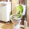 A toilet with a decorative lid and seat in a bathroom setting. Produktbild-Vorschau