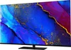 A television set with a colorful abstract image displayed on its screen, placed on a black stand. Produktbild-Vorschau