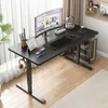 A modern home office setup with a black electric standing desk, computer monitor, laptop, and accessories. Podgląd zdjęcia produktu