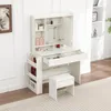 A white vanity table with a mirror, stool, and storage compartments, displaying various cosmetic items. Produktbild-Vorschau