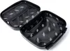An open black suitcase with a patterned interior, viewed from a slightly elevated angle. Náhled obrázku produktu