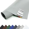 A rolled-up sheet of gray PVC material, likely a tarp or cover, is shown diagonally against a white background. A label with product information is attached to the material. Voir les images du produit