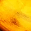 A close-up abstract view of a textured surface with variations in color and light. Produktbild-Vorschau
