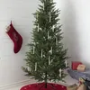 A Christmas tree decorated with candle-like lights, a stocking, and gifts. Podgląd zdjęcia produktu