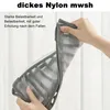 A person is holding a folded gray organizer, showing its flexibility and material. Produktbild-Vorschau