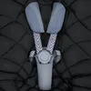 A close-up view of a black quilted footmuff with gray and light blue straps and buckle. Produktbild-Vorschau