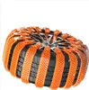 A close-up view of a car tire fitted with orange snow chains. Náhled obrázku produktu